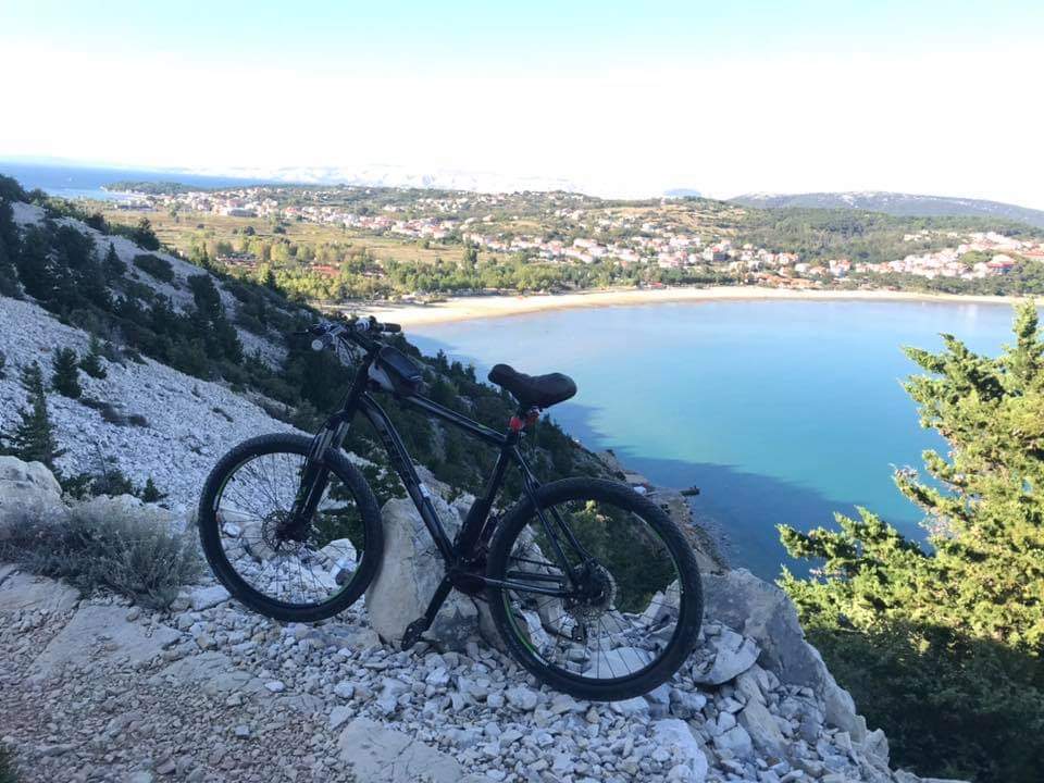 Mountain biking coastal trail sea views Rab Island active travel for professionals physical challenge Croatia