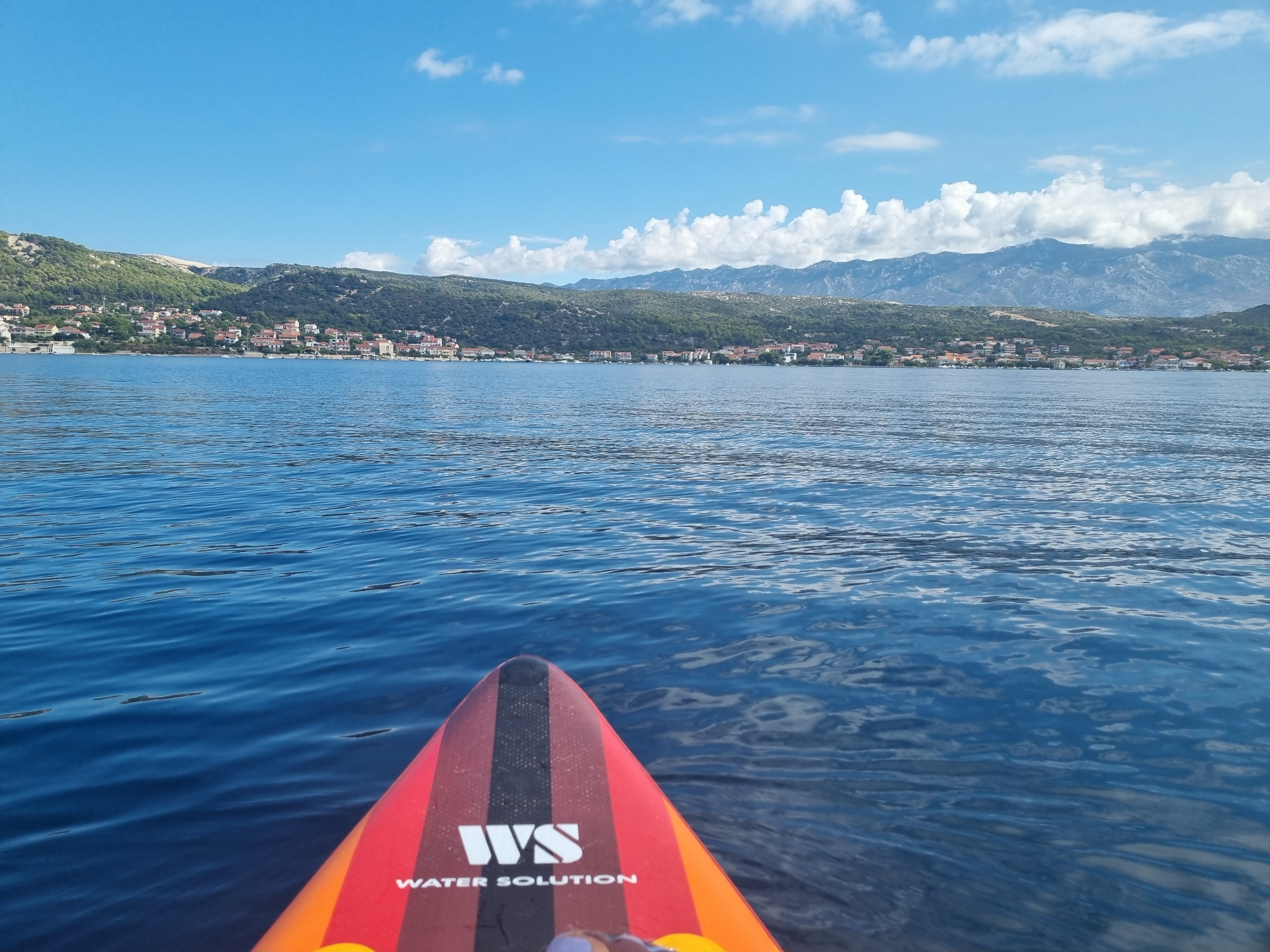 Stand up paddleboarding Croatian coastline Rab Island water sports wellness retreat for men and women outdoor mindset