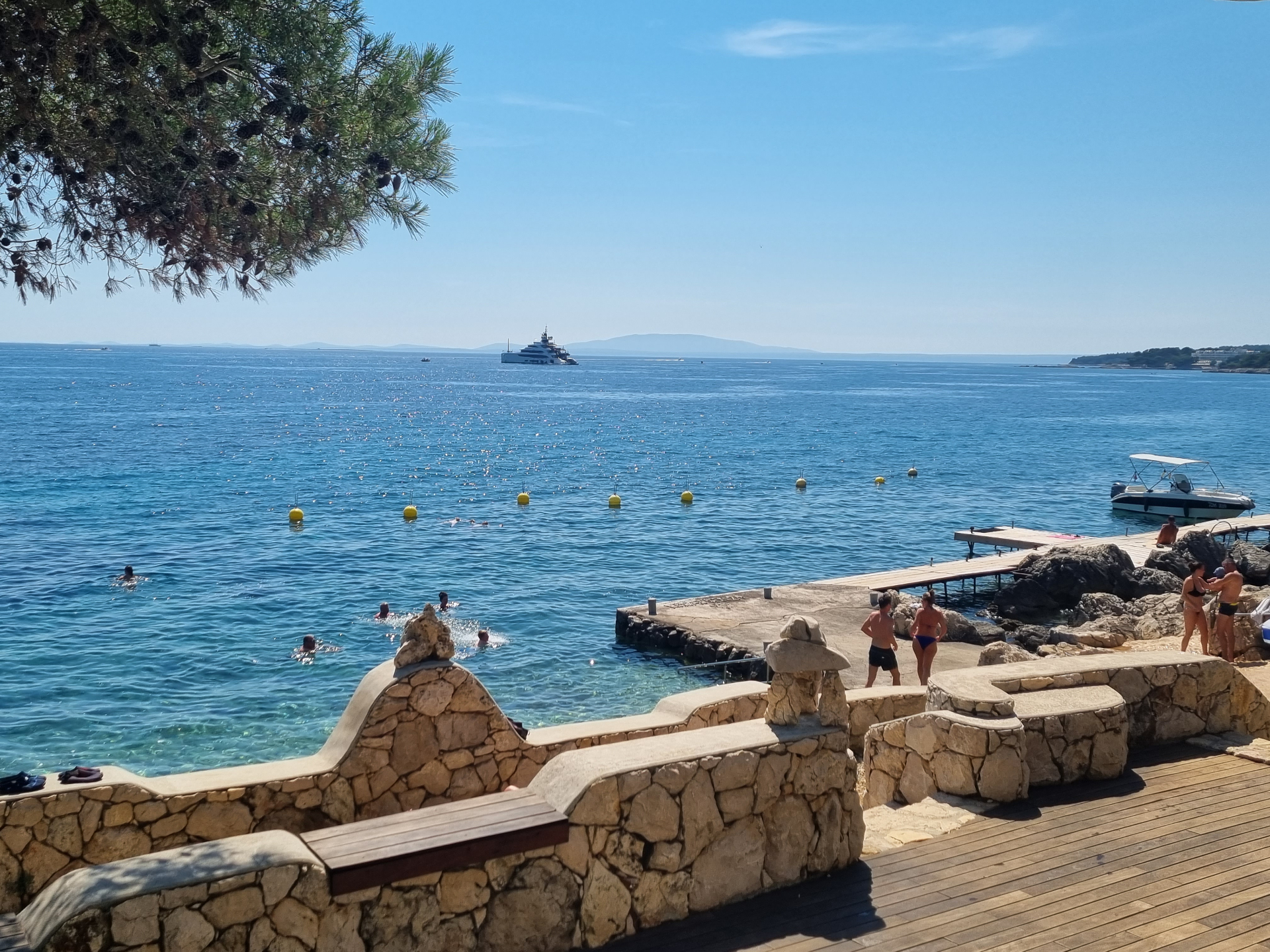 Crystal clear Adriatic Sea swimming deck Rab Island active travel Croatia executive fitness getaway