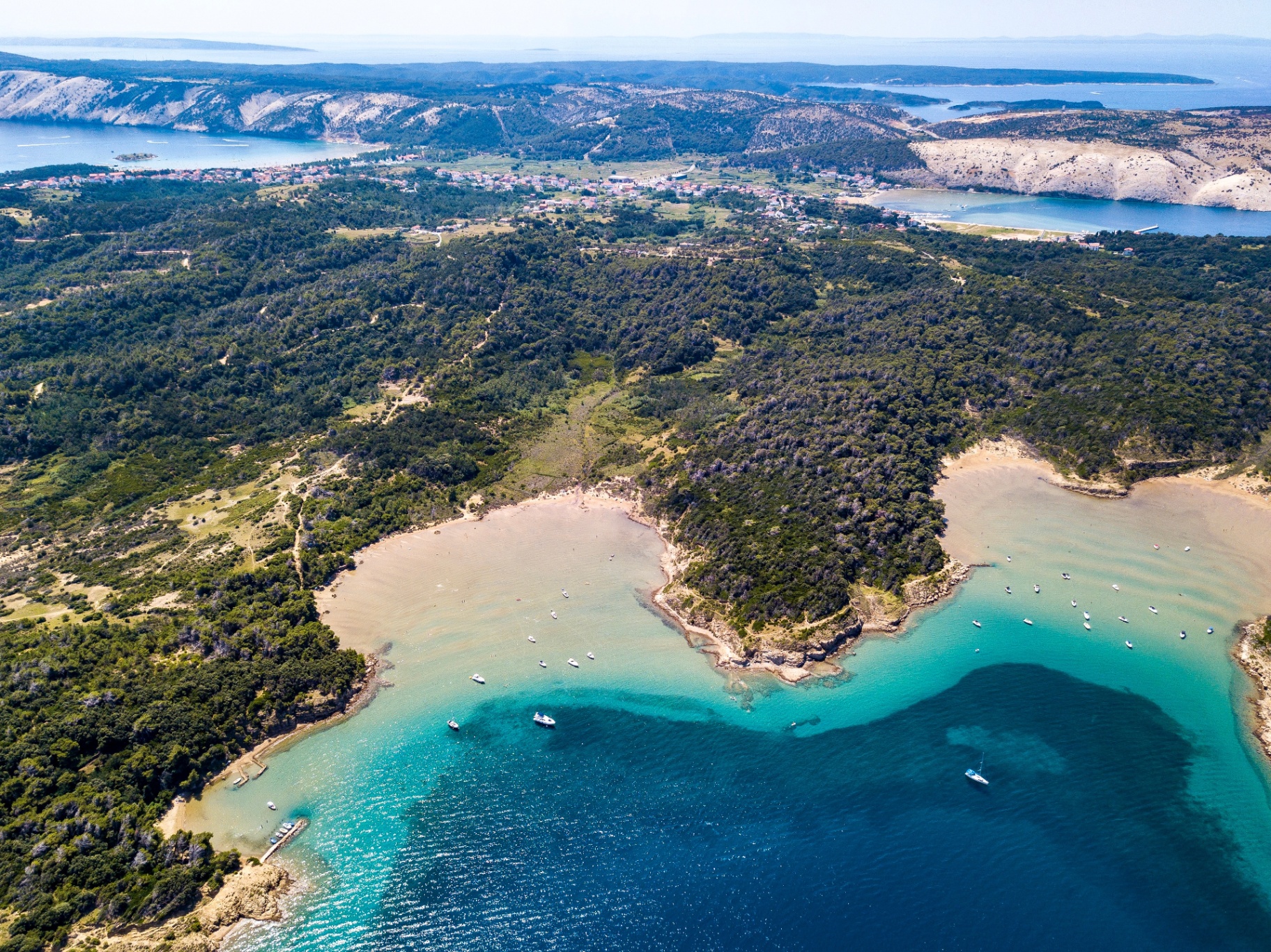 Aerial crystal clear turquoise bay Rab Island beyond the tourist trail Croatia authentic Adriatic experience